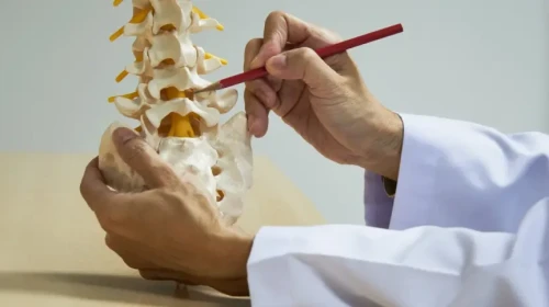 physiatrist explaining spine care solutions