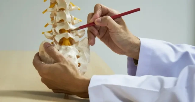 physiatrist explaining spine care solutions